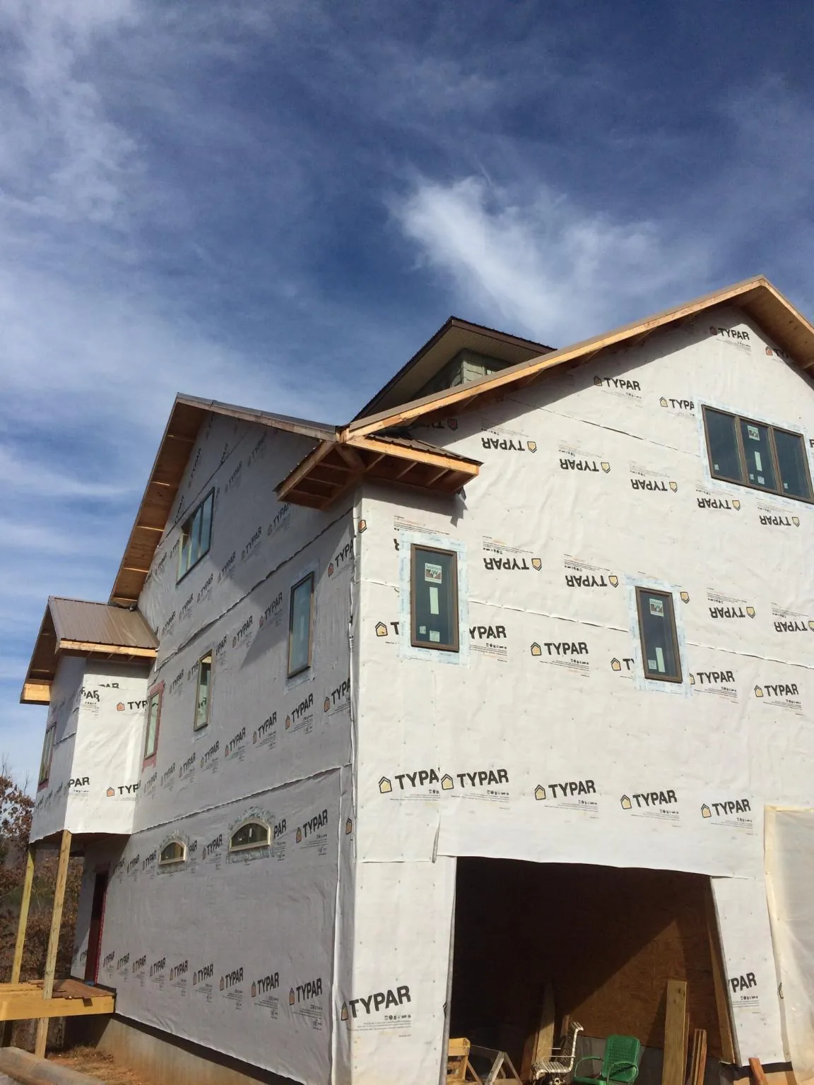 Stick built house wrapped in Typar with new roof framing and dormers in Raymore